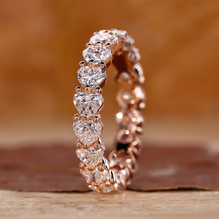Heart shaped diamond band with prong setting.