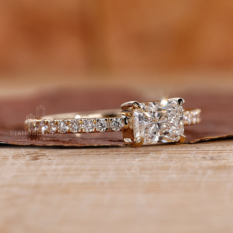 East to west setting in radiant cut engagement ring.
