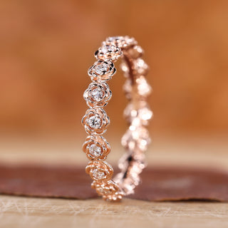 Flower style wedding band with rose gold wedding band.
