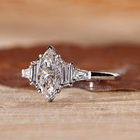 5 stone diamond ring in Tapered Baguette side stone design.
