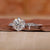 Side stone ring with round cut diamonds

