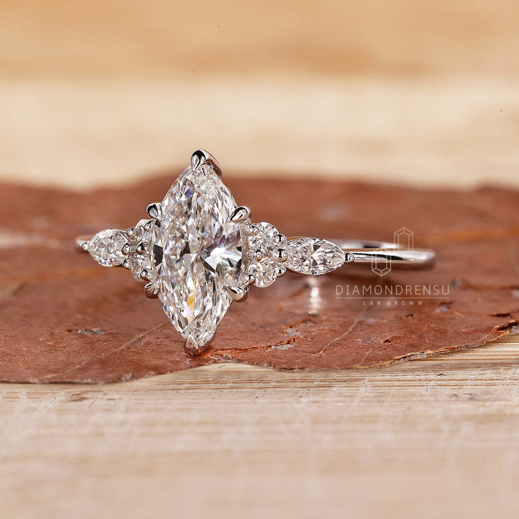 6 claw prong setting holds marquise diamond securely.
