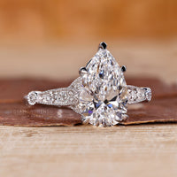 Milgrain setting ring with vintage design and claw prong setting.

