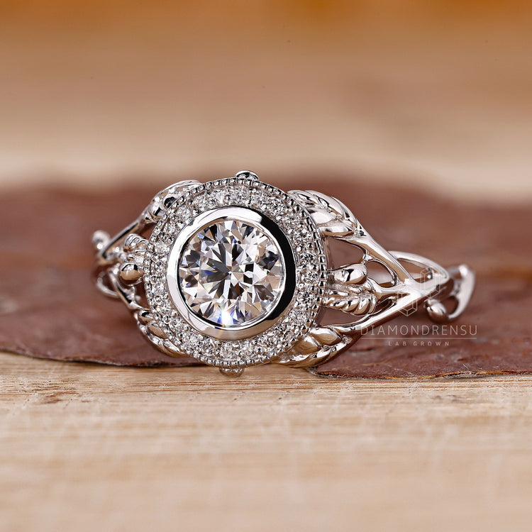 IGI certified round diamond in nature inspired bezel ring.

