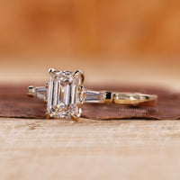 Tapered Baguette side stone in a 3 stone engagement ring.
