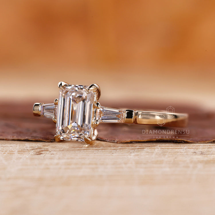 Tapered Baguette side stone in a 3 stone engagement ring.
