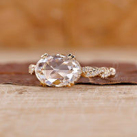 Round cut pave band in a yellow gold diamond ring setting.
