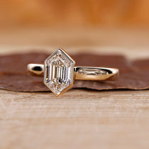 Bezel set ring with hexagon cut diamond.
