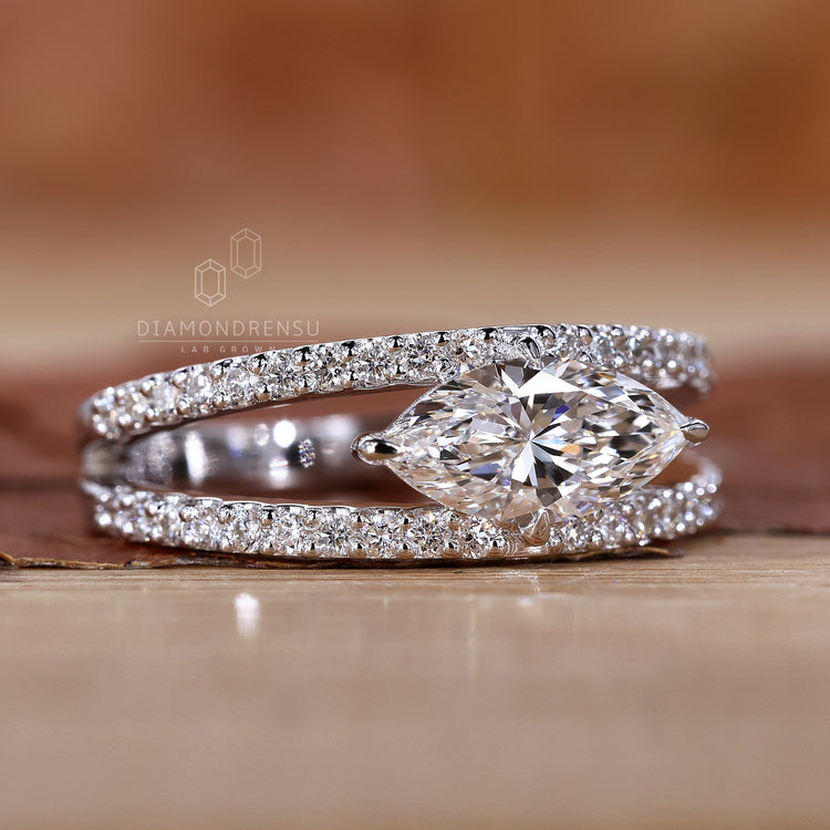 East west marquise engagement ring in white gold.
