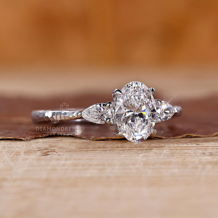 4 claw prong setting on custom diamond ring.
