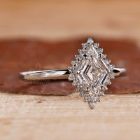 Lozenge diamond engagement ring in prong setting.
