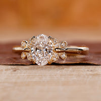 Butterfly setting engagement ring with 4 claw prong setting.
