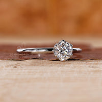 round cut solitaire ring with white gold finish.
