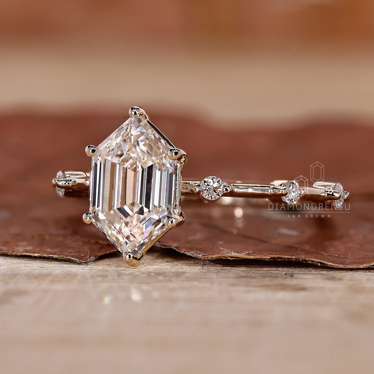 round diamond side stones in hexagon step cut ring.
