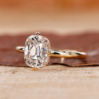 Solitaire setting ring with 4 prong claw and hidden halo.
