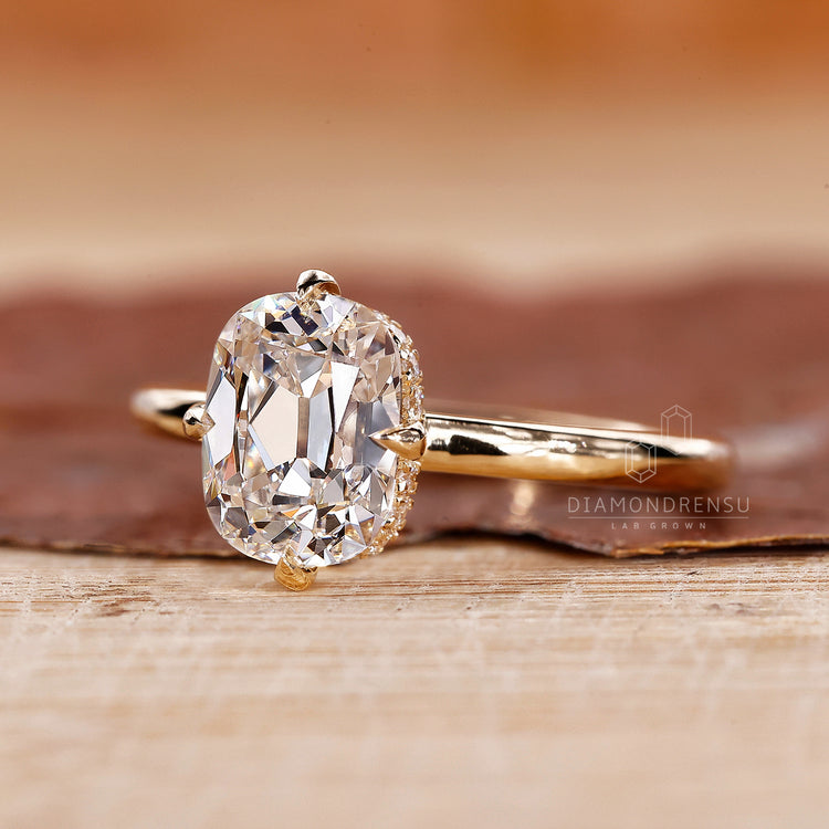 Solitaire setting ring with 4 prong claw and hidden halo.
