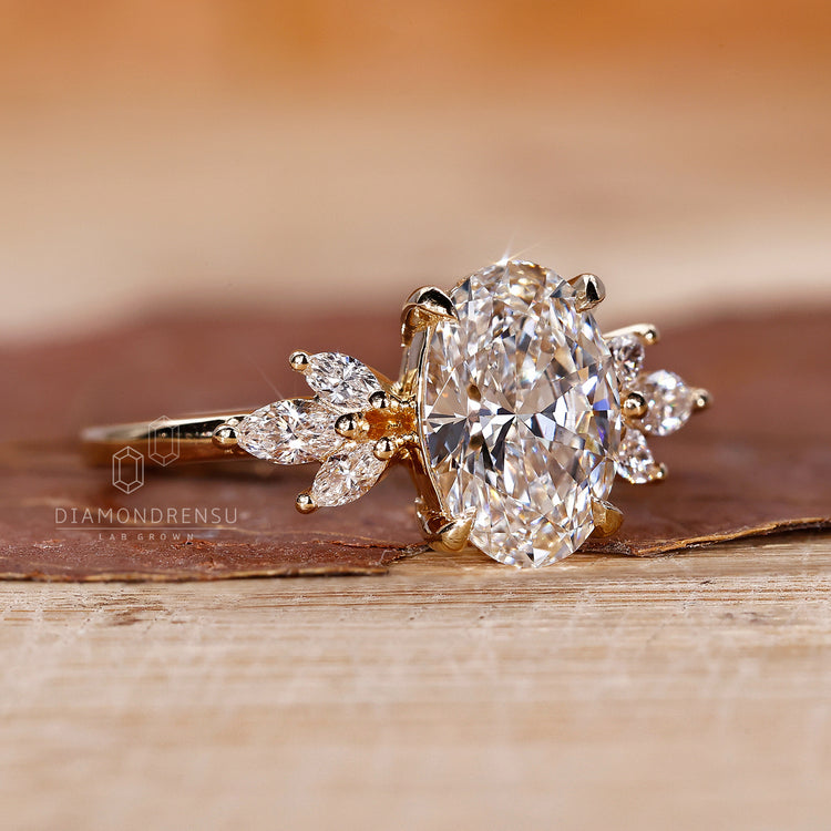7 stone ring with oval and marquise cut diamonds and hidden halo in yellow gold.
