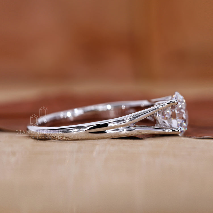 White gold engagement ring made in split shank style.
