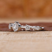 Round side stone ring set in white gold ring.
