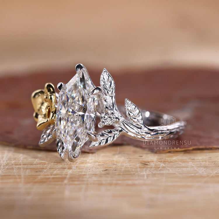 White gold ring with Dutch marquise diamond and nature inspired setting.
