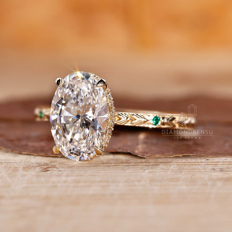Yellow gold ring featuring a hidden halo and round diamond design.
