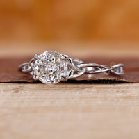 Prong setting ring with Portuguese cut diamond crafted in a sleek white gold band.

