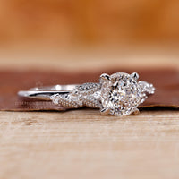 Claw prong setting ring with Portuguese cut diamond in white gold.
