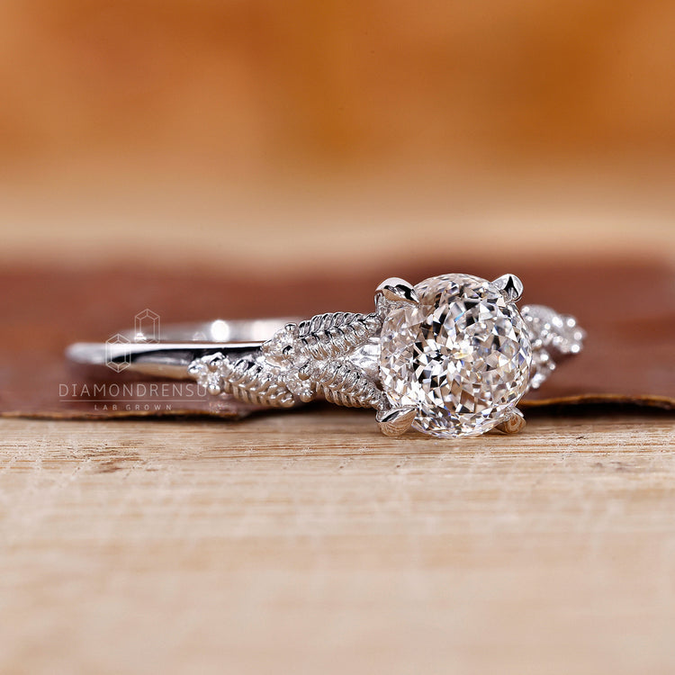 Claw prong setting ring with Portuguese cut diamond in white gold.
