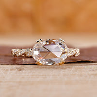 Yellow gold diamond ring with twisted pave and east west setting.
