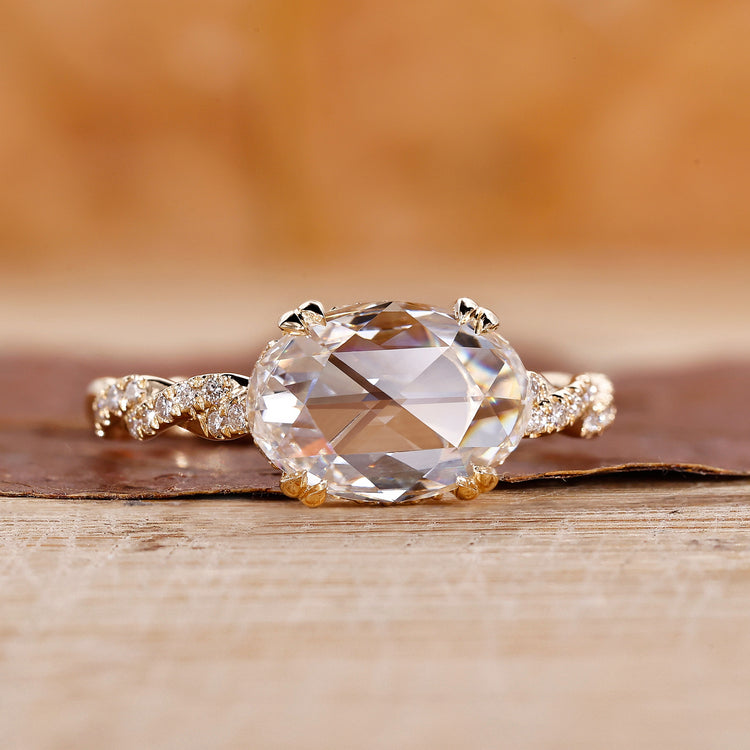 Yellow gold diamond ring with twisted pave and east west setting.
