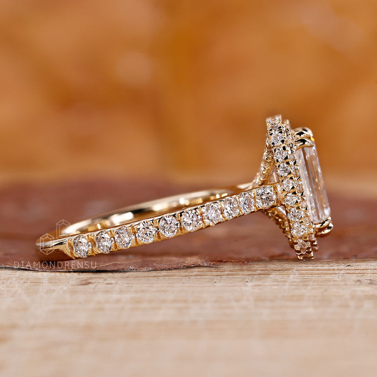 Round diamond paired with unique engagement ring.
