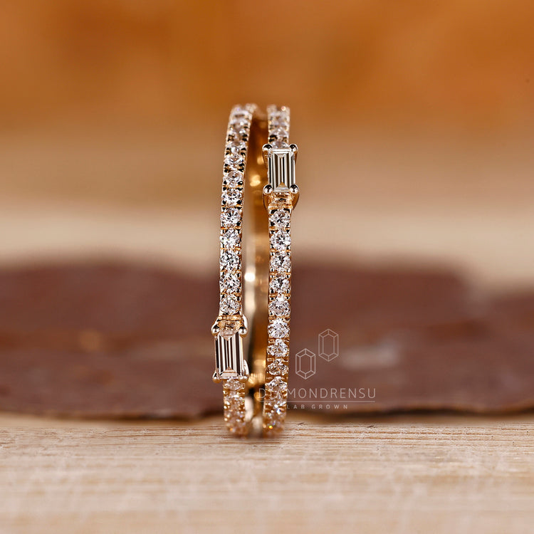 Yellow Gold Wedding Band featuring baguette and round diamonds.
