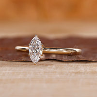 Tapered shank band in marquise diamond engagement ring.
