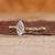 Tapered shank band in marquise diamond engagement ring.
