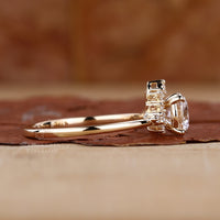 round cut side stones in yellow gold diamond ring.
