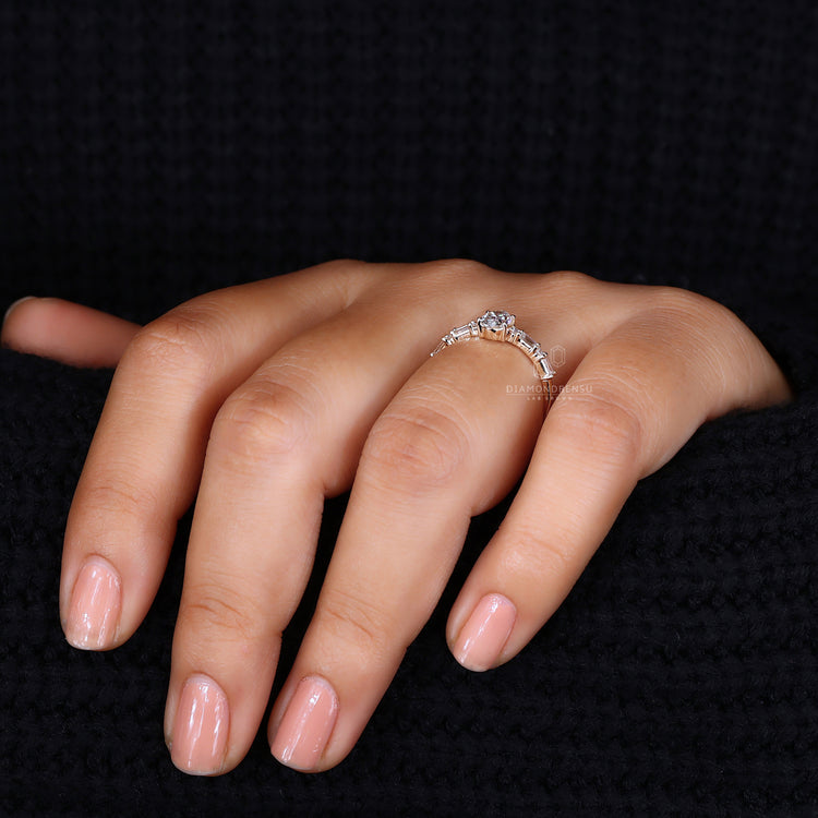 Engagement ring Australia with oval centre diamond.
