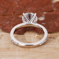 white gold engagement ring with 4 claw prong setting.
