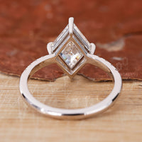 Customise ring using lozenge cut engagement ring.
