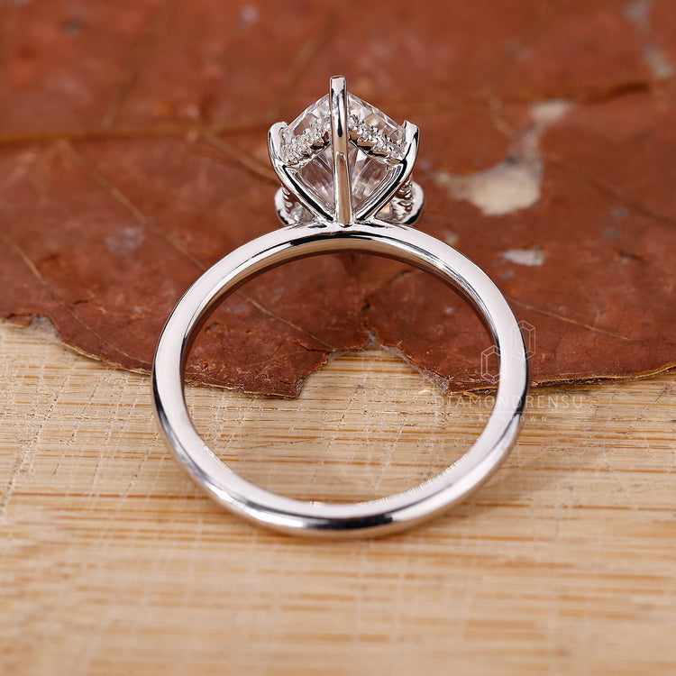 white gold ring with round cut hidden halo setting.

