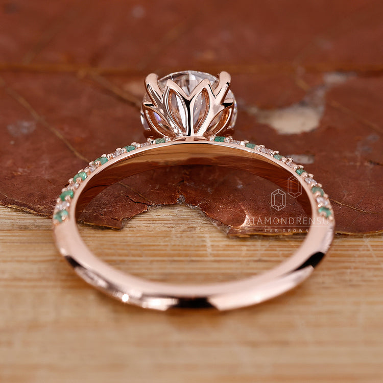 Rose gold ring with pavé setting and round cut lab grown diamond.

