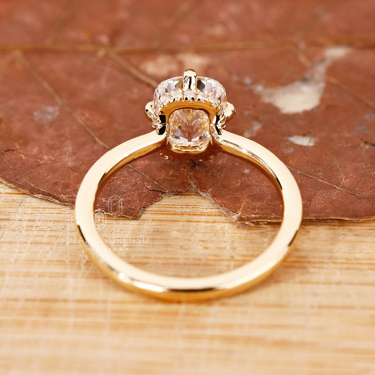 Custom diamond ring crafted in yellow gold solitaire style.
