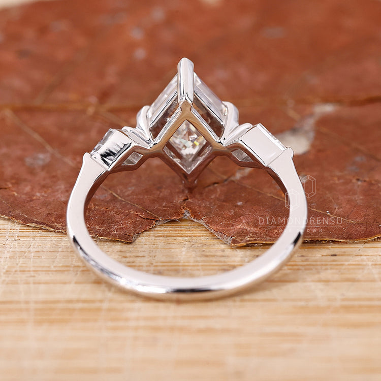 white gold engagement ring with v prong setting.
