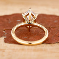Custom diamond ring made with a 6 claw prong and handmade finish.
