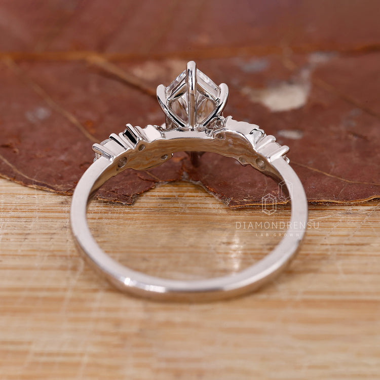 Buy engagement ring with Dutch marquise diamond and claw prongs.
