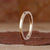 Double row diamond band with brilliant round cut stones.
