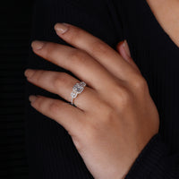 Cushion cut diamond ring set in round diamond pave setting ring.
