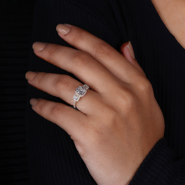 Cushion cut diamond ring set in round diamond pave setting ring.
