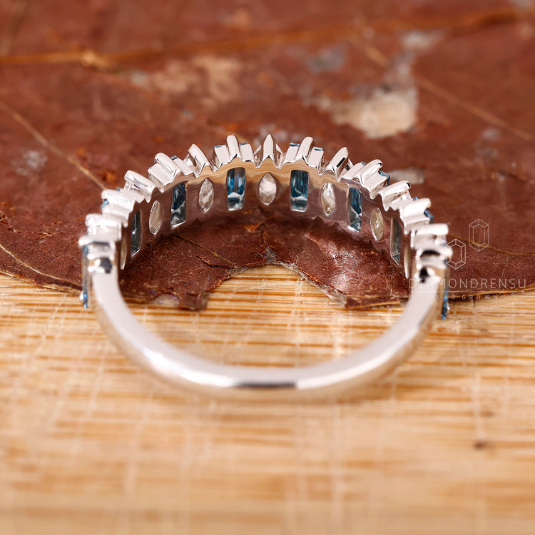 Marquise and baguette diamond half eternity band.
