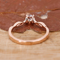 Buy engagement ring with twisted shank and round cut diamond.
