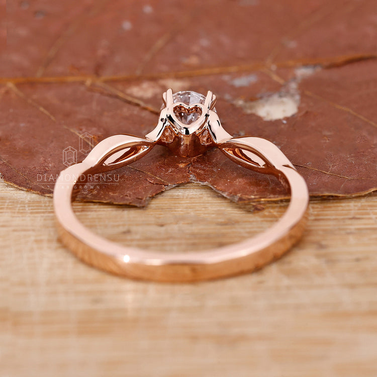 Buy engagement ring with twisted shank and round cut diamond.
